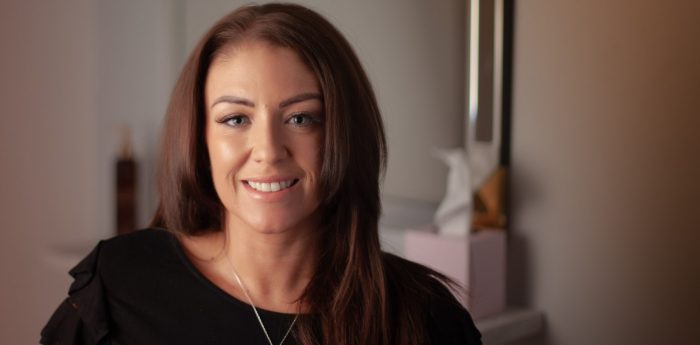 Smiling Female Client With Long Brown Enhancer System