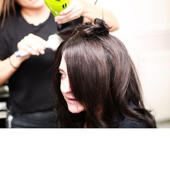 Female client with brown hair having blow dry
