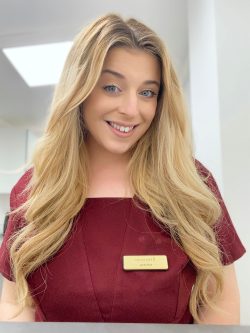 Katharine at work at Hair Solved in her uniform